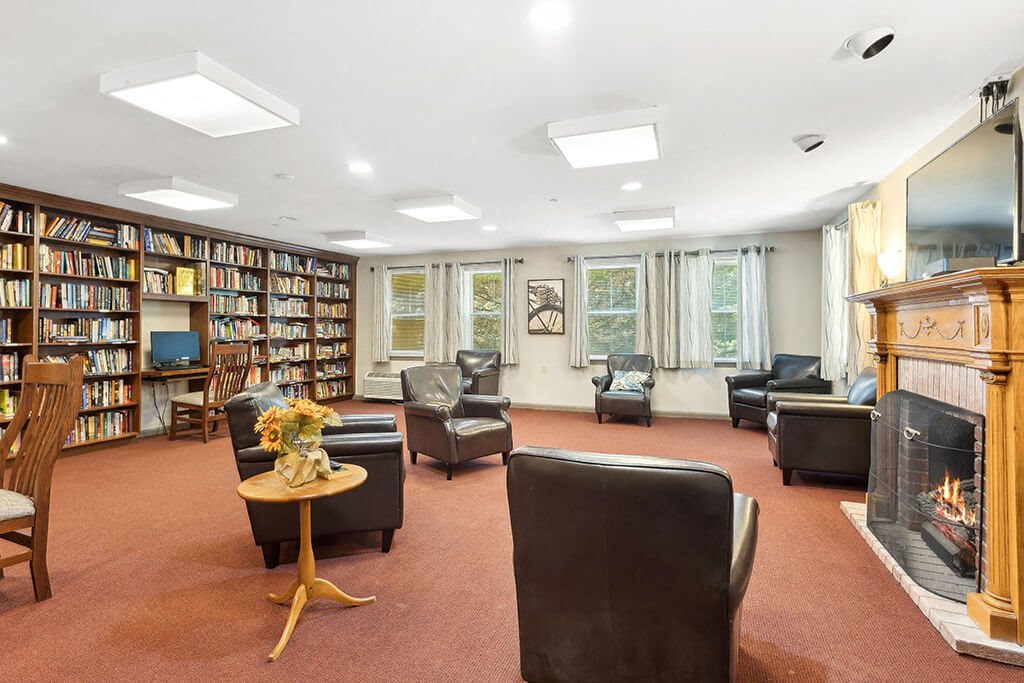 Community social lounge and library at Fairbrooke Senior Apartments in Aberdeen MD